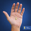 A coated caplet rests on a hand, measuring 3/4 inch or 1.905 cm, illustrating size in comparison.