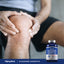 Adult man holds his knee beside a bottle of Glucosamine Chondroitin, implying joint support.