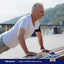 Senior man doing push-ups on a bench with an MSM supplement bottle nearby.