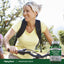A middle-aged woman rides her bicycle outdoors, carrying a bottle of Strontium Citrate.