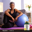 An older woman exercises with an exercise ball next to a bottle of Bromelain.